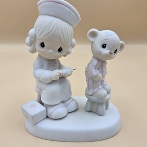 Precious Moments White and Pink Nurse Figurine